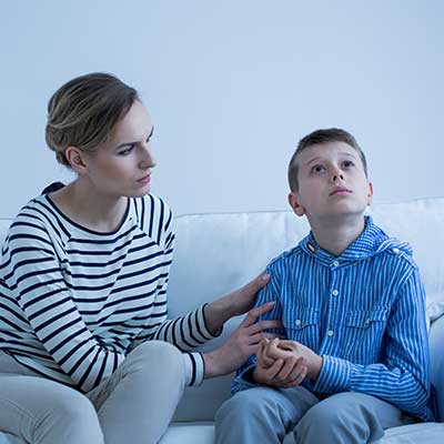 autistic-boy-being-comforted-by-mother-vanguard-psychiatry